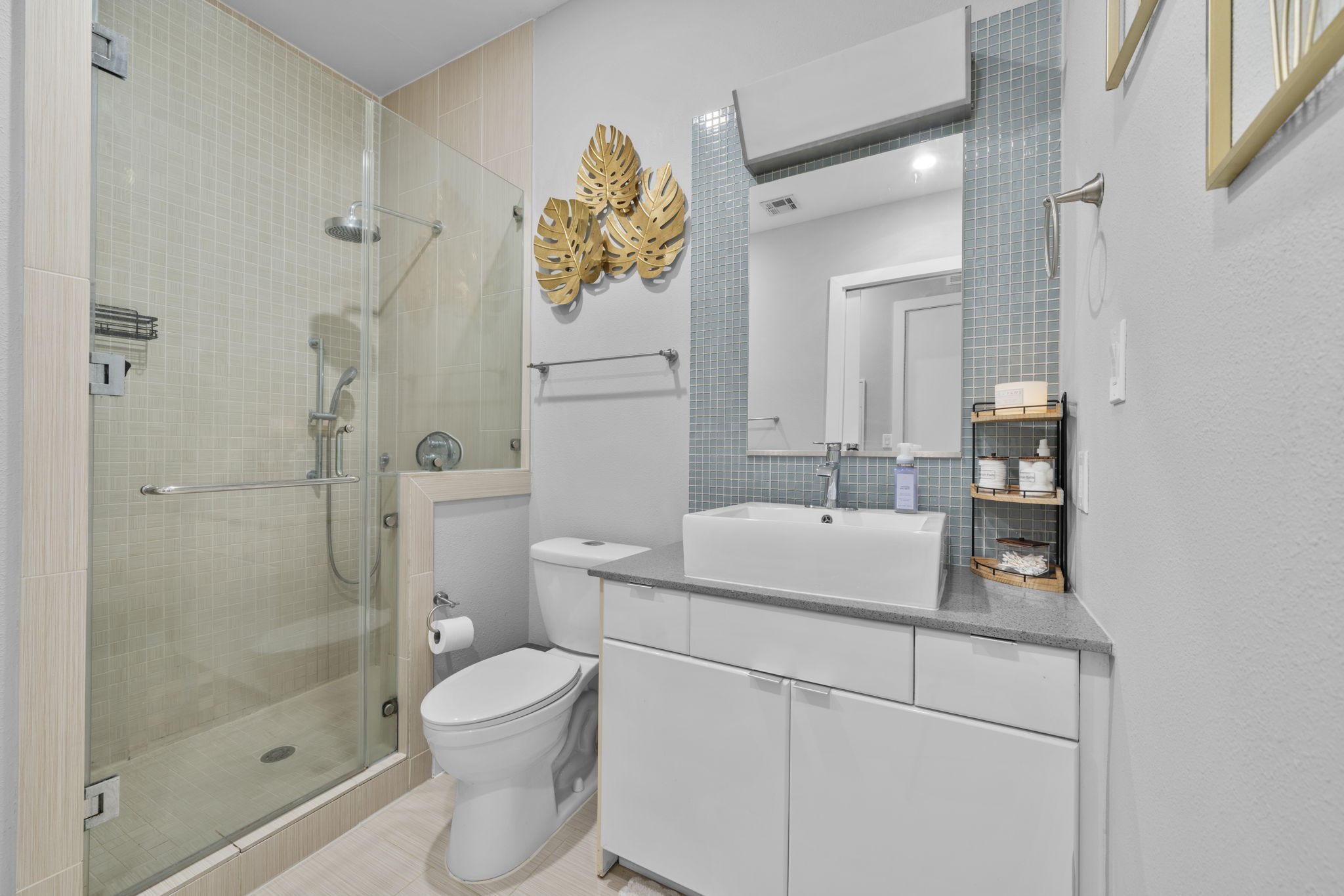 207 Pierce Street, Unit 209 Houston, TX 77002 - Photo 10 of 13 a bathroom with a sink toilet and shower