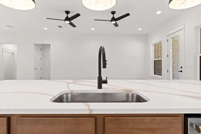 a bathroom with a toilet a sink and a mirror