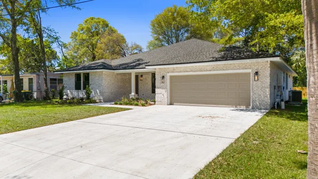 a front view of a house with yard