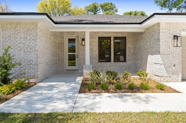 a kitchen with a sink and a chandelier