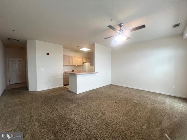 9000 Bay Avenue, Unit 106 North Beach, MD 20714 - Photo 4 of 12 a view of a kitchen with a sink and cabinet area