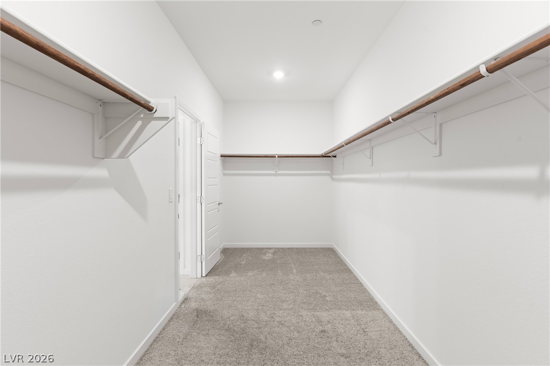 320 Isla Enclave Way Henderson, NV 89011 - Photo 18 of 49 This spacious walk-in closet offers ample storage with convenient shelving and hanging rods.