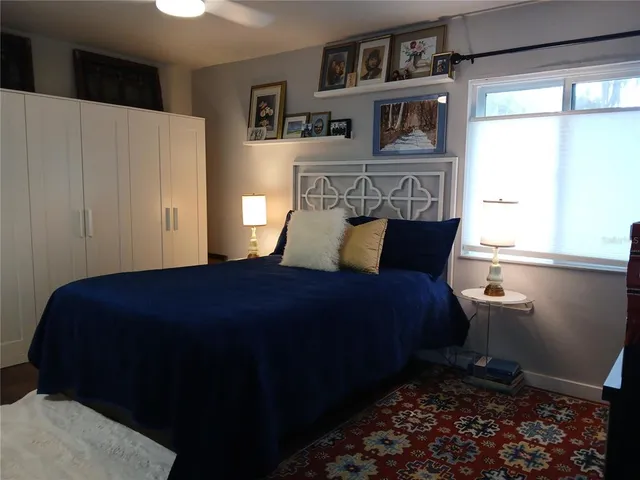 a living room with furniture wooden floor and a table