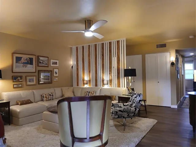 a kitchen with stainless steel appliances a stove a microwave and a sink