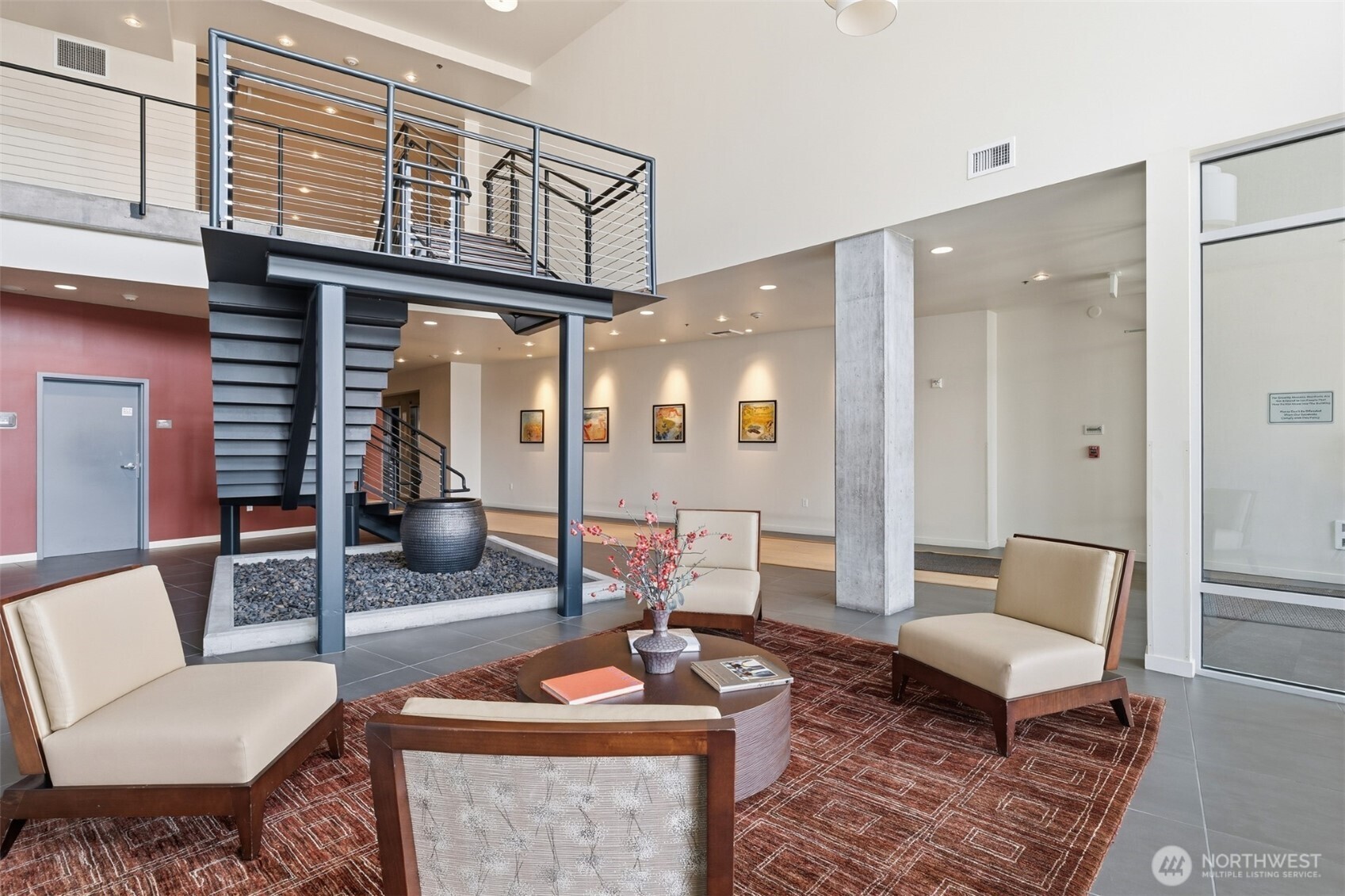 15100 6th Avenue Southwest, Unit 723 Burien, WA 98166 - Photo 15 of 23 a living room with furniture and a rug