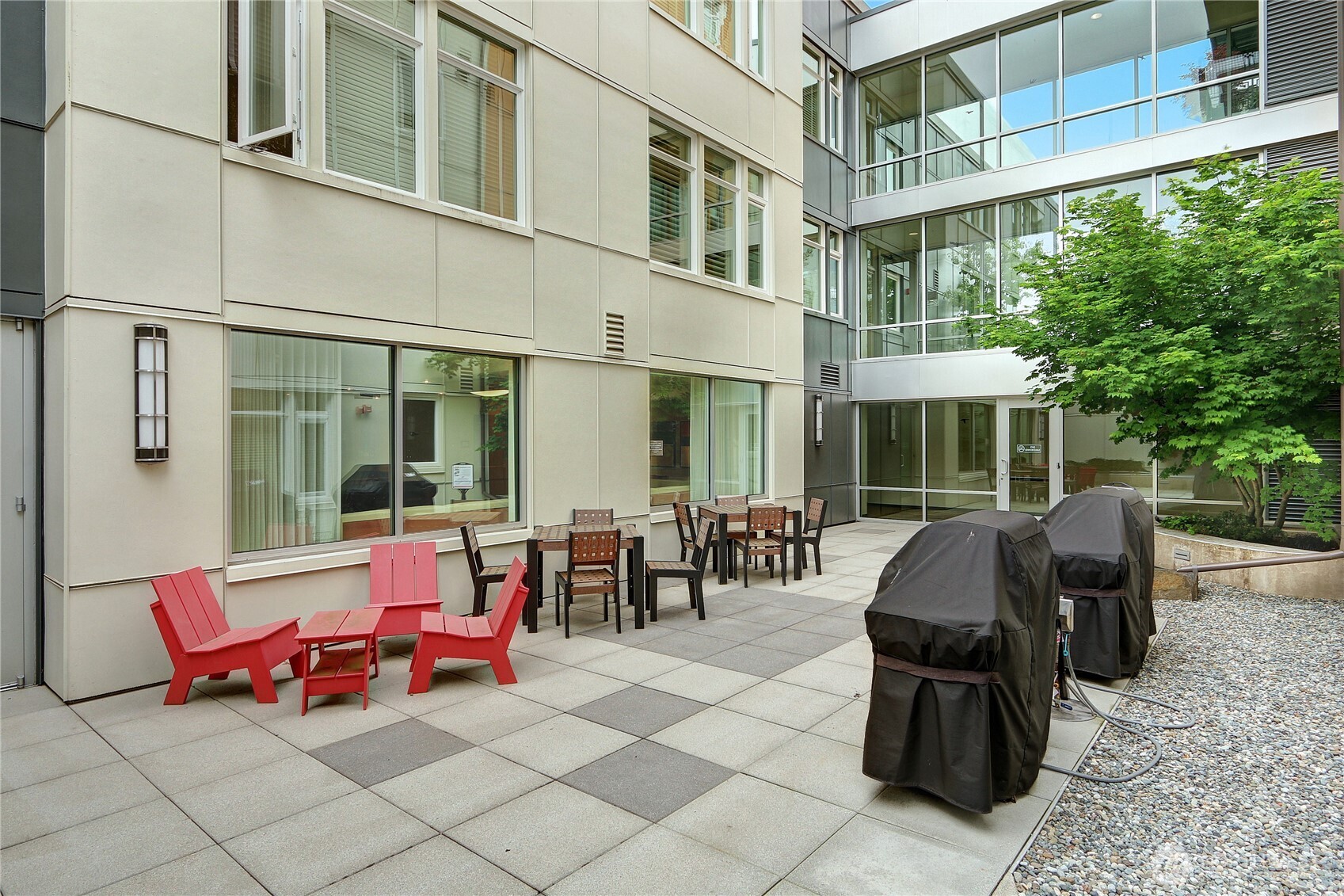 15100 6th Avenue Southwest, Unit 723 Burien, WA 98166 - Photo 20 of 23 a building outdoor space with patio furniture and potted plants