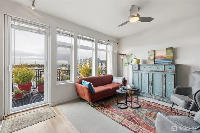 a living room with furniture and a window