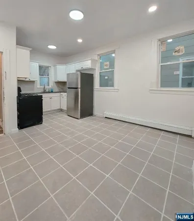 a view of a kitchen with a sink and microwave