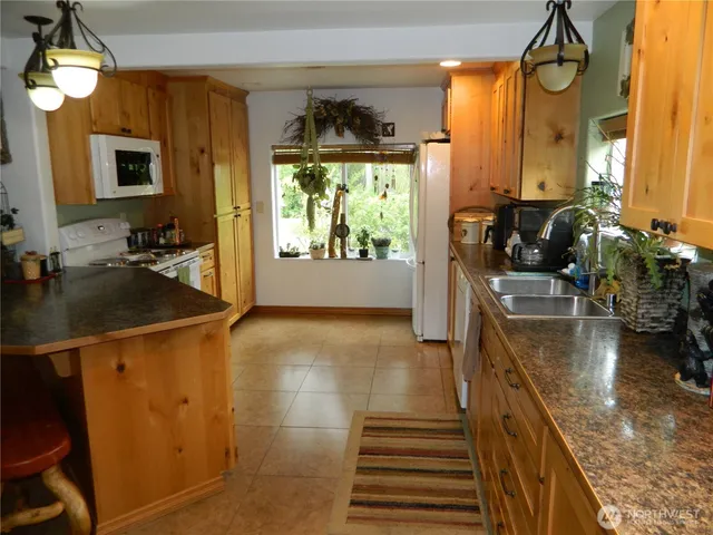 a kitchen with sink and window