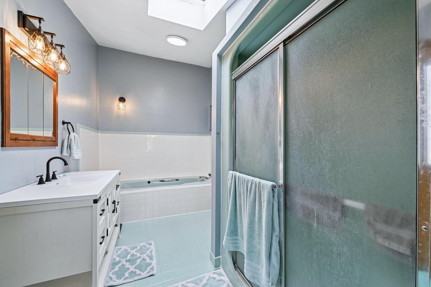 17401 Milltown Landing Road Brandywine, MD 20613 - Photo 52 of 96 a bathroom with a sink a mirror and shower