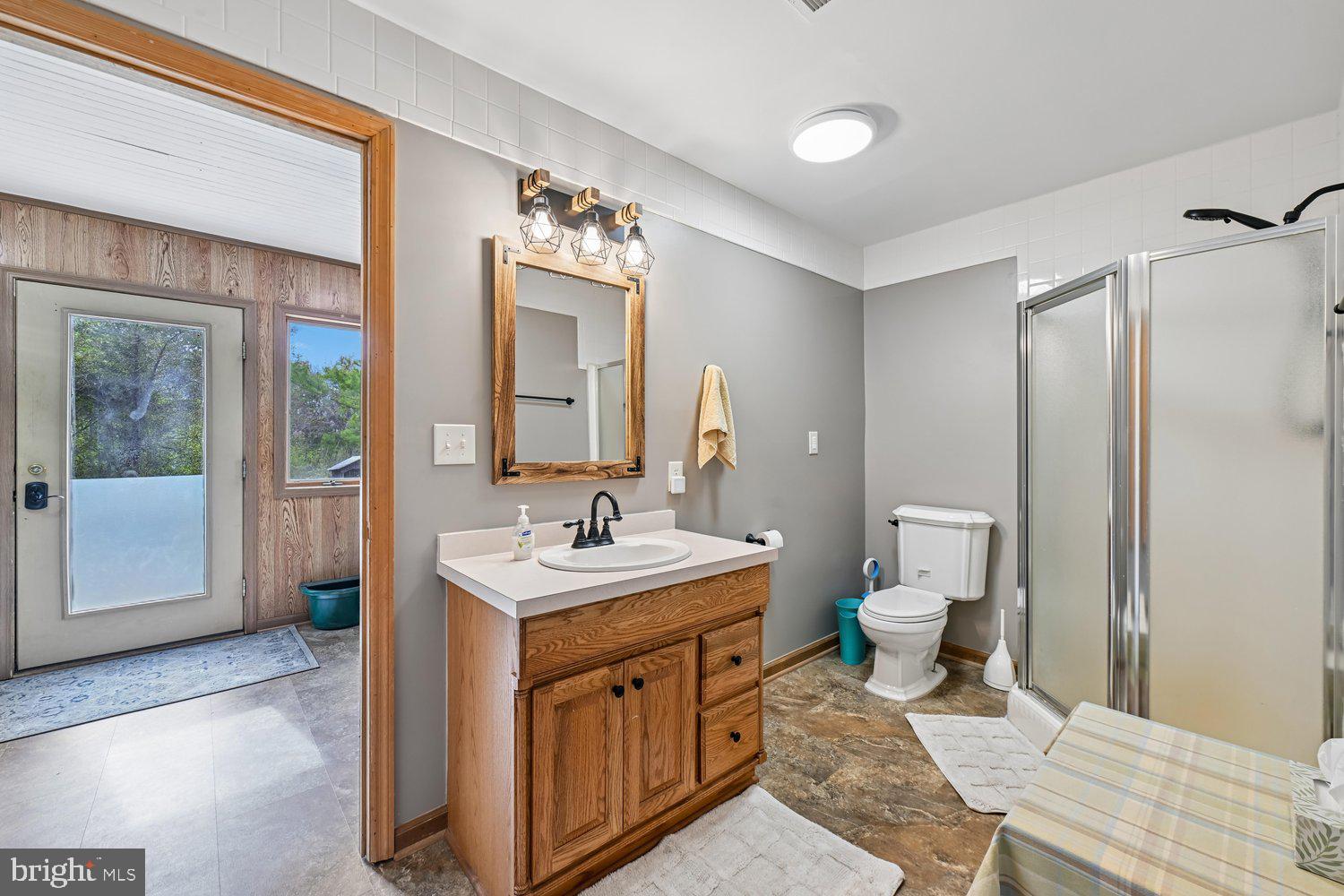 17401 Milltown Landing Road Brandywine, MD 20613 - Photo 55 of 96 a spacious bathroom with a toilet sink and mirror
