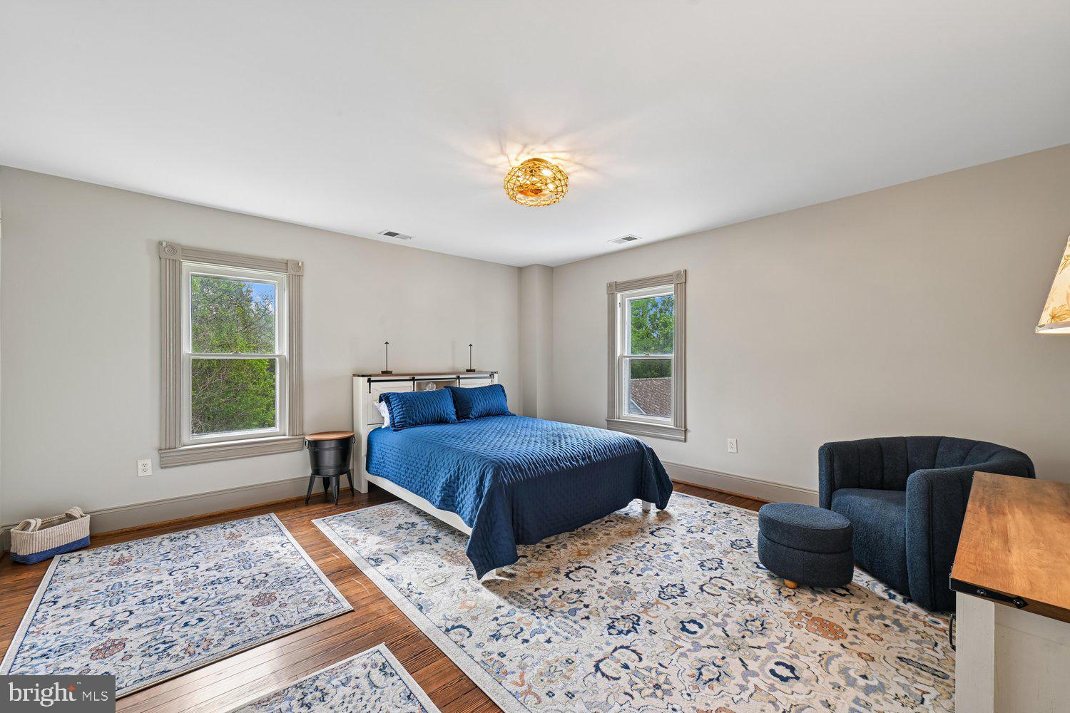17401 Milltown Landing Road Brandywine, MD 20613 - Photo 62 of 96 a bedroom with a bed and wooden floor