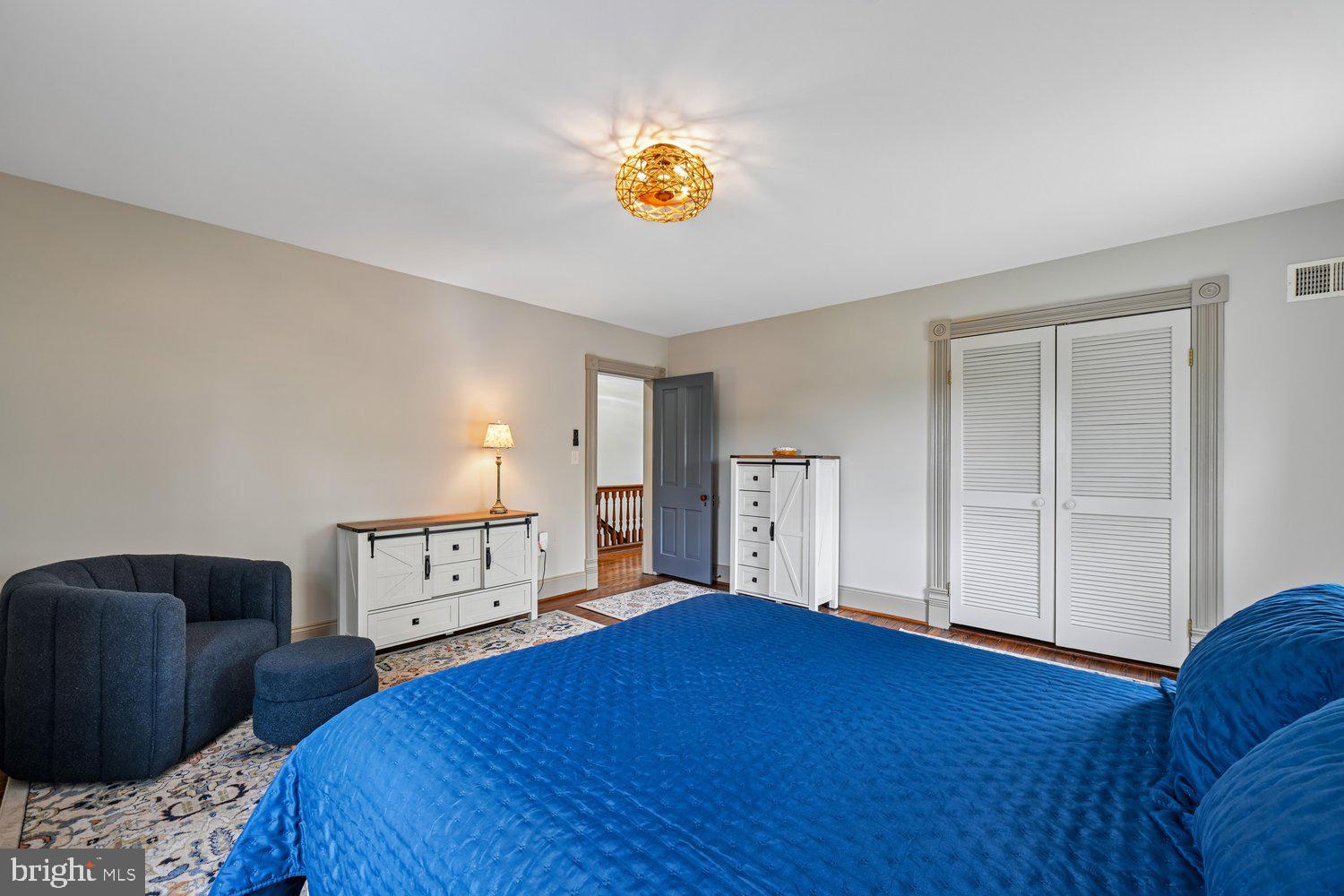 17401 Milltown Landing Road Brandywine, MD 20613 - Photo 64 of 96 a bedroom with a bed and a chandelier