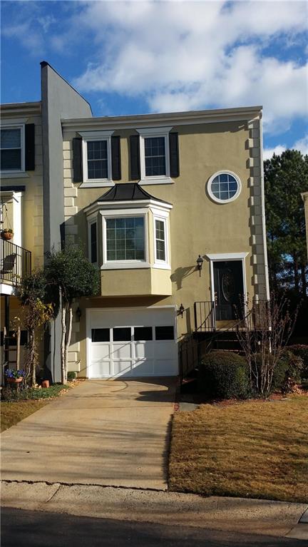 21 Sycamore Station Decatur, GA 30030 - Photo 1 of 1 a front view of a house with a garage