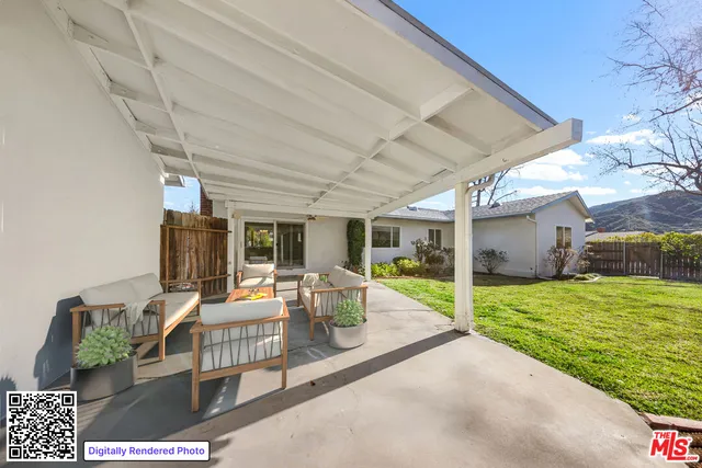 a yellow house with trees in front of it