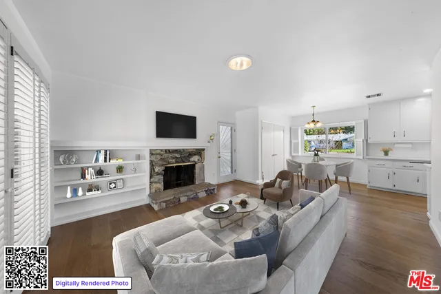 a kitchen with stainless steel appliances a sink a stove a microwave a sink and cabinets