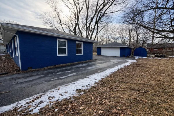 a house with trees in the background