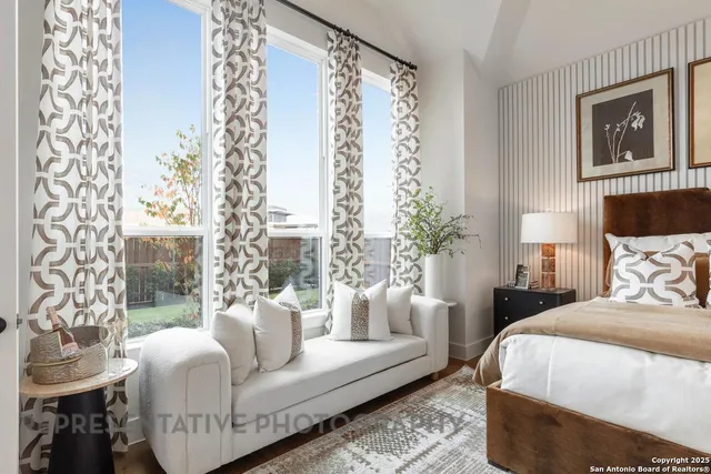 a bedroom with a large bed and a couch