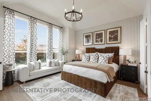 a bedroom with a large bed and a couch