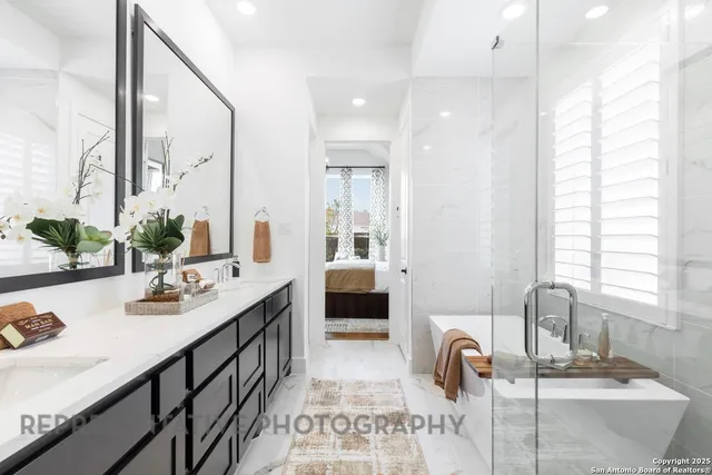 a bathroom with a double vanity sink and a mirror