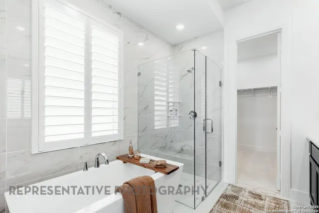 a bath room with a bath tub and a shower