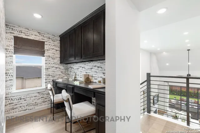 a kitchen with a sink cabinets and appliances