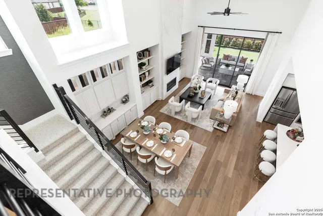 a view of living room with furniture and wooden floor