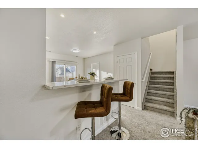 a kitchen with a table and chairs