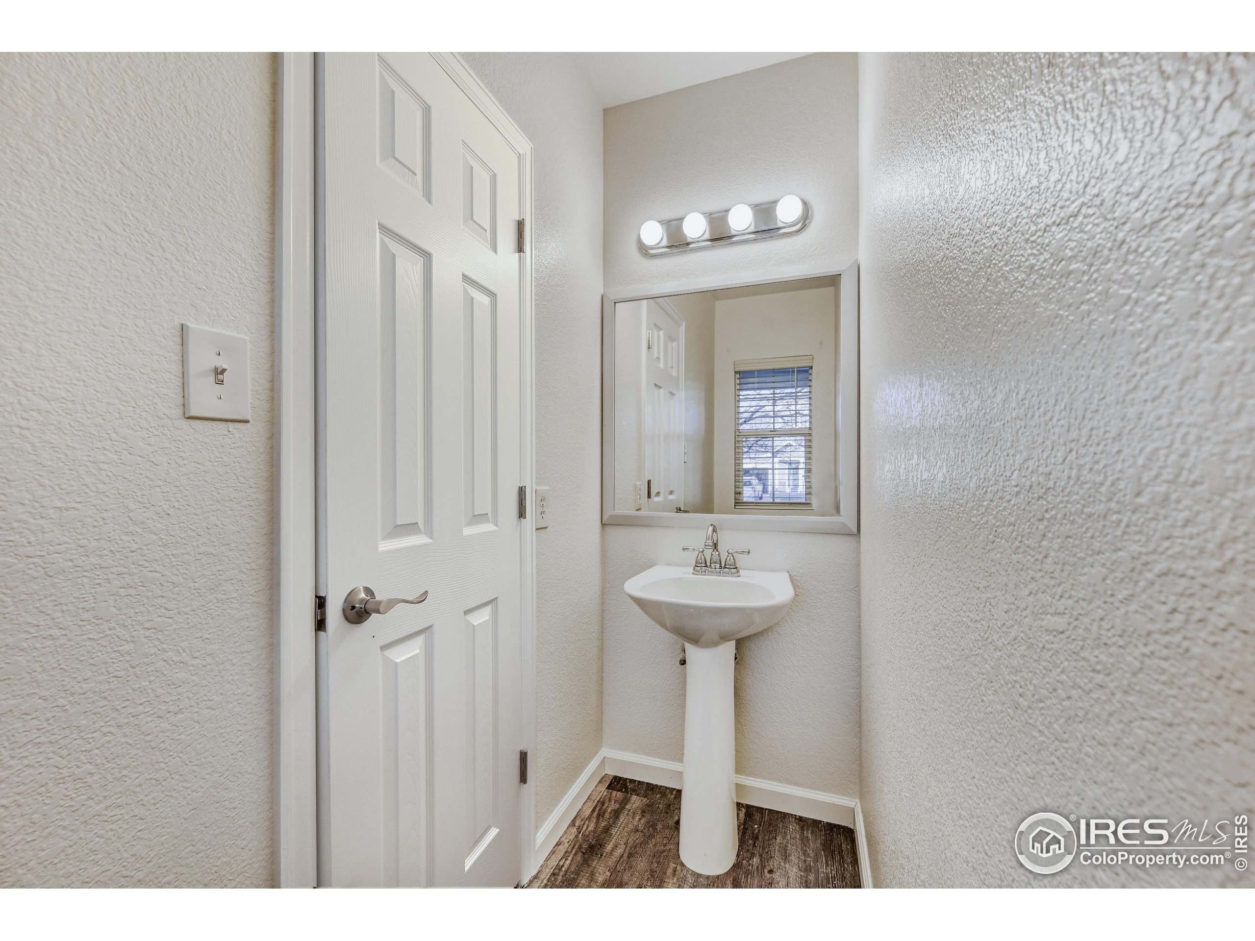 6130 Gorham Street Frederick, CO 80530 - Photo 23 of 48 a bathroom with a sink and a mirror