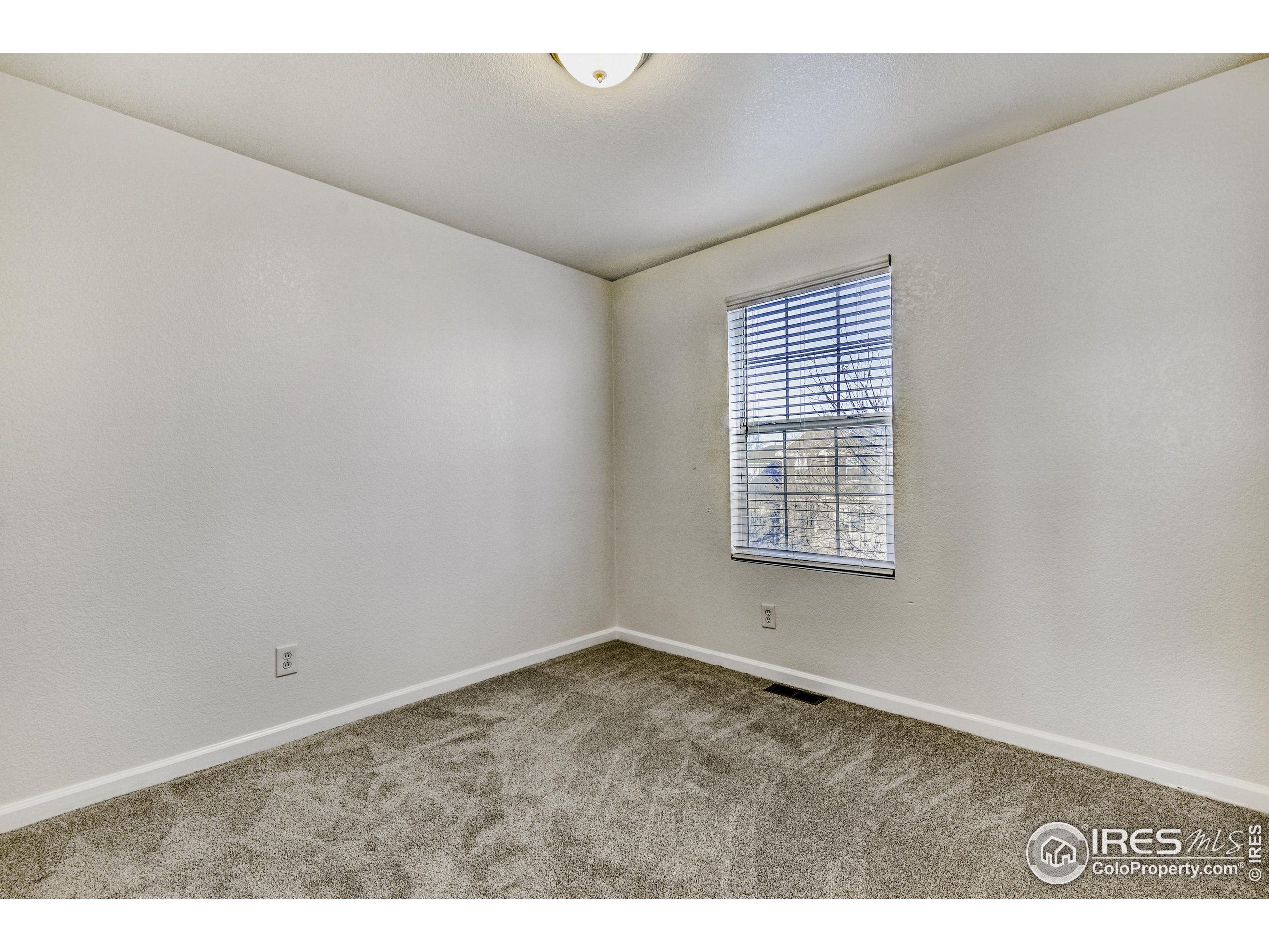 6130 Gorham Street Frederick, CO 80530 - Photo 37 of 48 a view of an empty room with a window