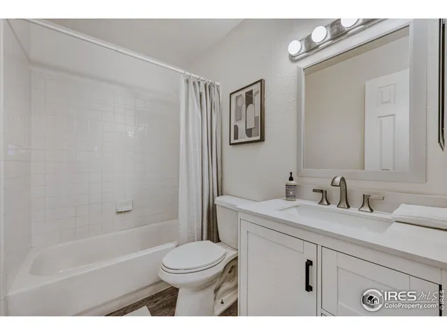 a utility room with dryer washer and sink