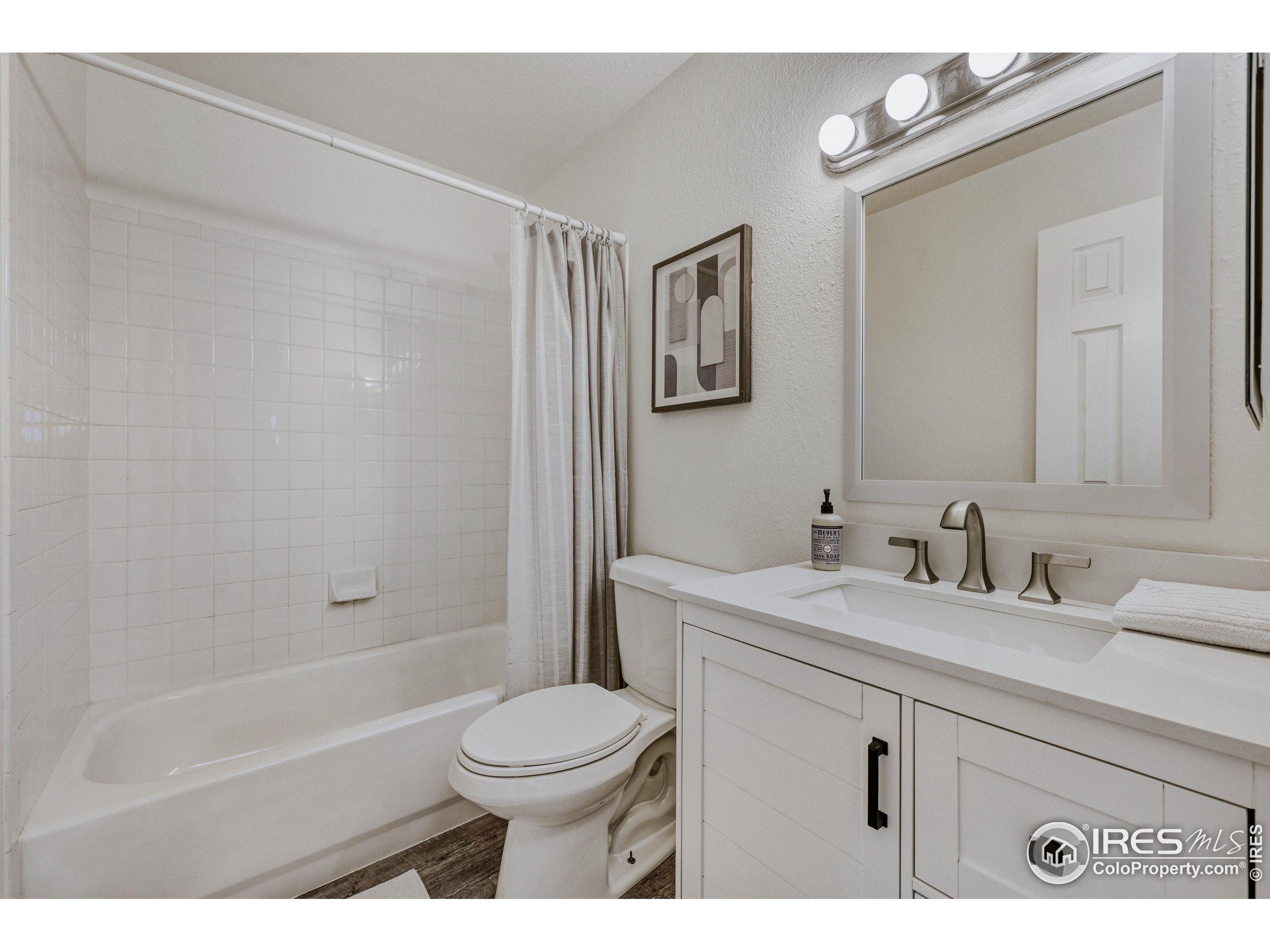 6130 Gorham Street Frederick, CO 80530 - Photo 40 of 48 a bathroom with a sink a toilet and shower