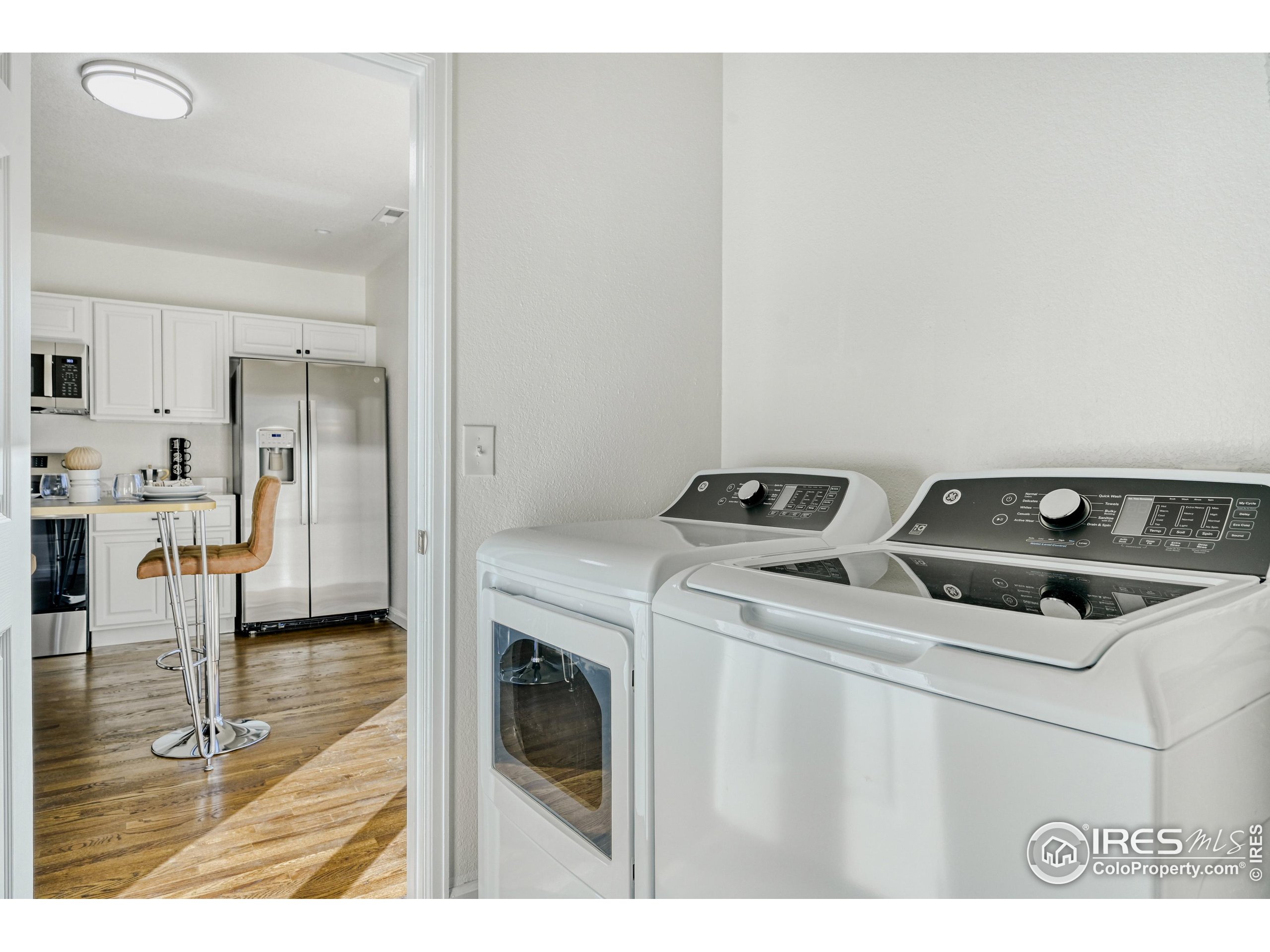 6130 Gorham Street Frederick, CO 80530 - Photo 41 of 48 a utility room with dryer washer and sink