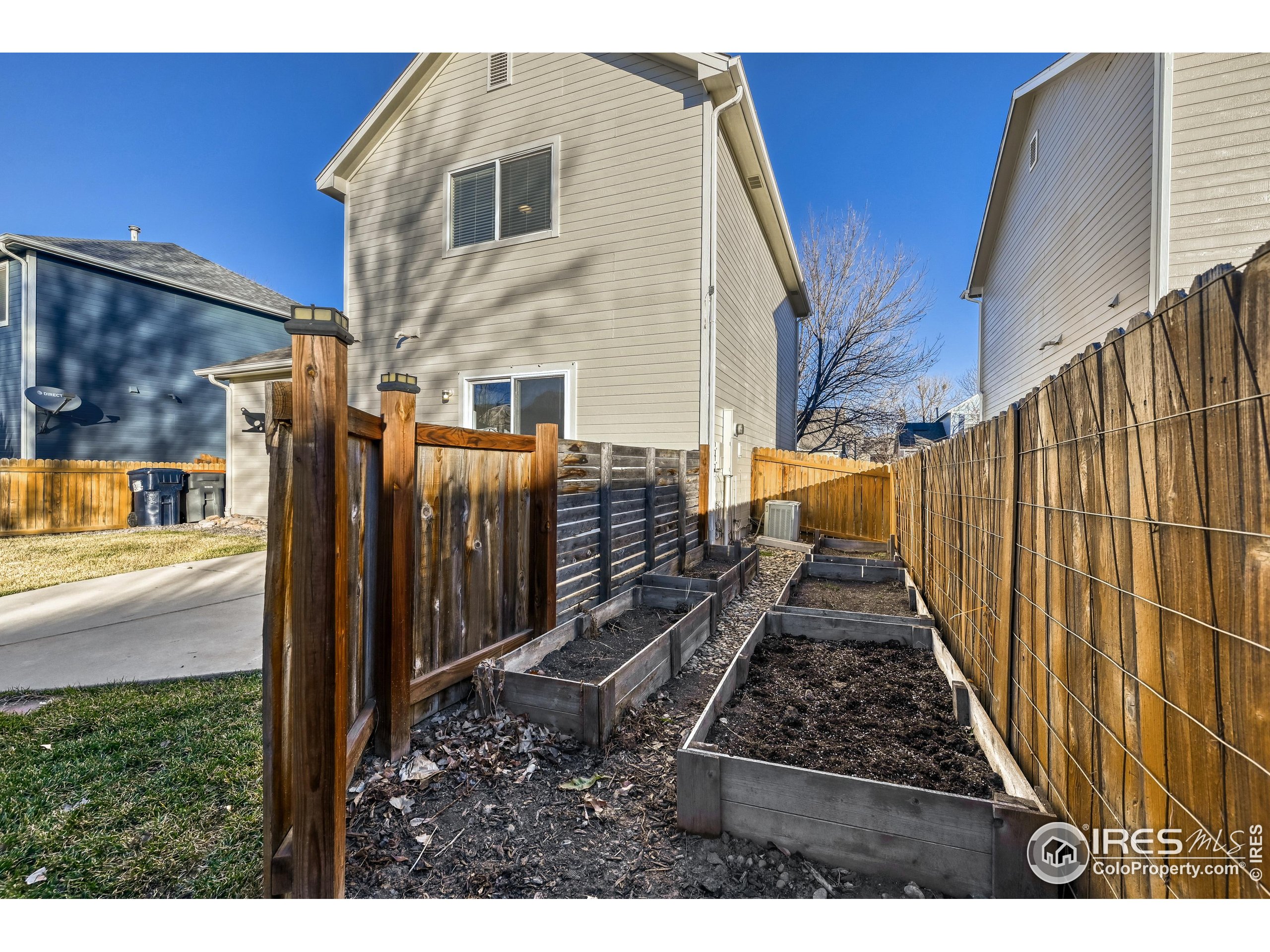 6130 Gorham Street Frederick, CO 80530 - Photo 47 of 48 a view of a house with a backyard