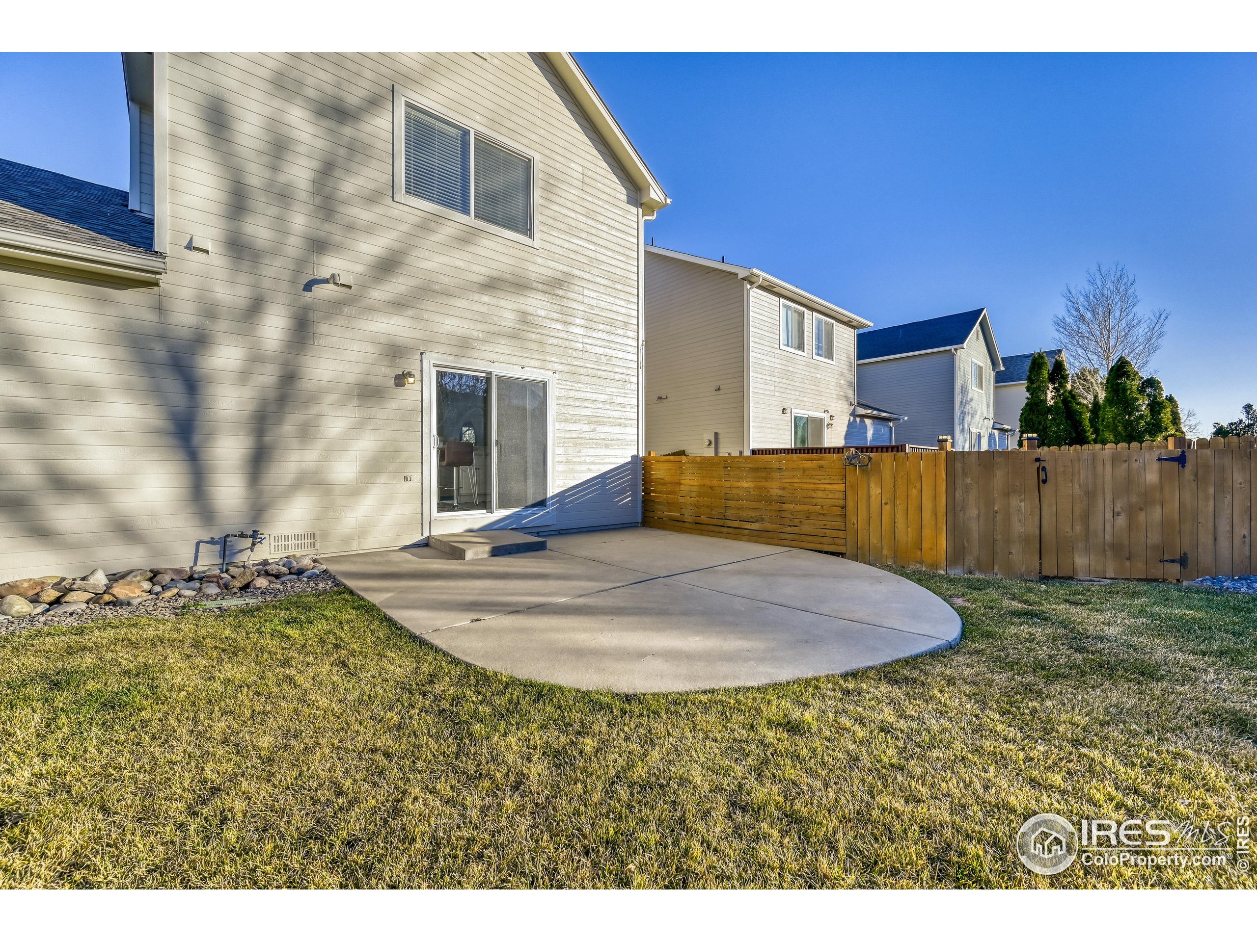 6130 Gorham Street Frederick, CO 80530 - Photo 48 of 48 a view of a house with backyard and wooden fence