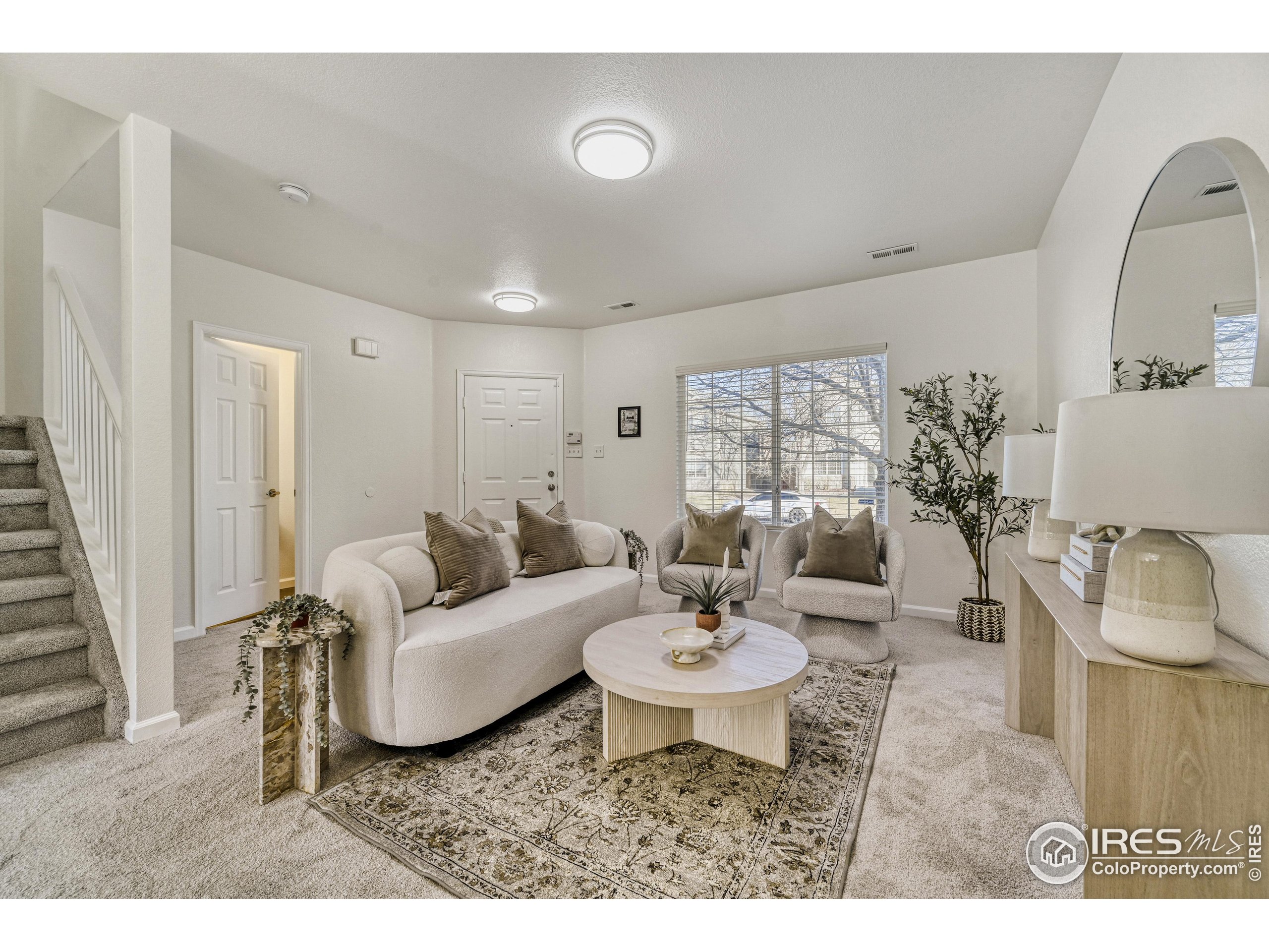 6130 Gorham Street Frederick, CO 80530 - Photo 7 of 48 a living room with furniture and a large window