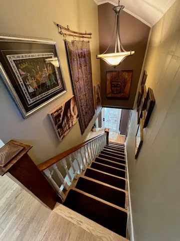 a bedroom with a bed window and a dresser