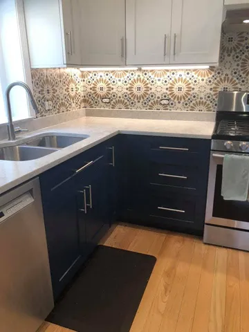 a kitchen with a sink and cabinets