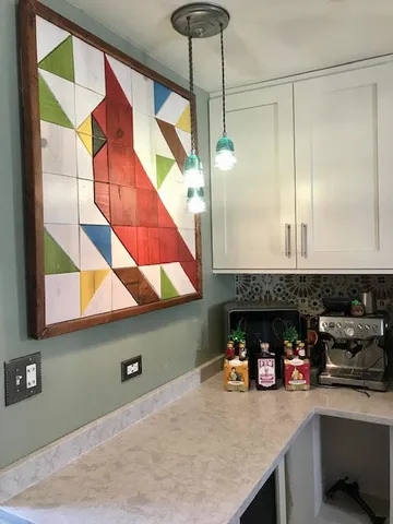 a kitchen with stainless steel appliances double vanity and a sink