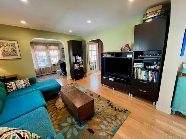 a living room with furniture and a flat screen tv