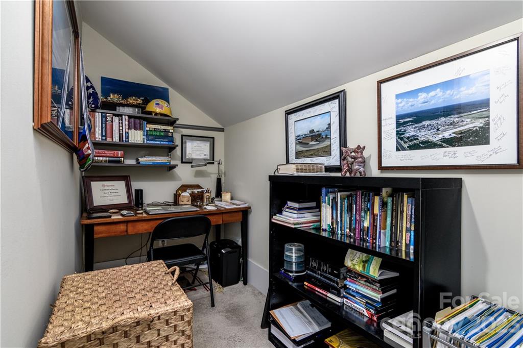 205 Coneflower Place Fort Mill, SC 29708 - Photo 21 of 38 a view of a workspace with bookshelf and a workspace