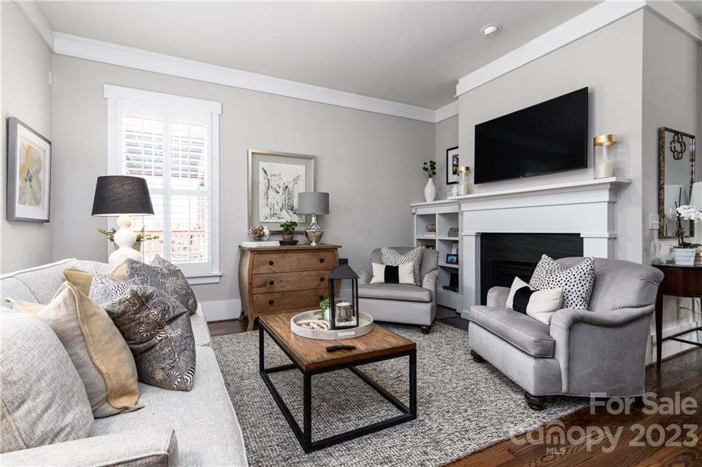 205 Coneflower Place Fort Mill, SC 29708 - Photo 6 of 38 a living room with furniture a flat screen tv and a fireplace
