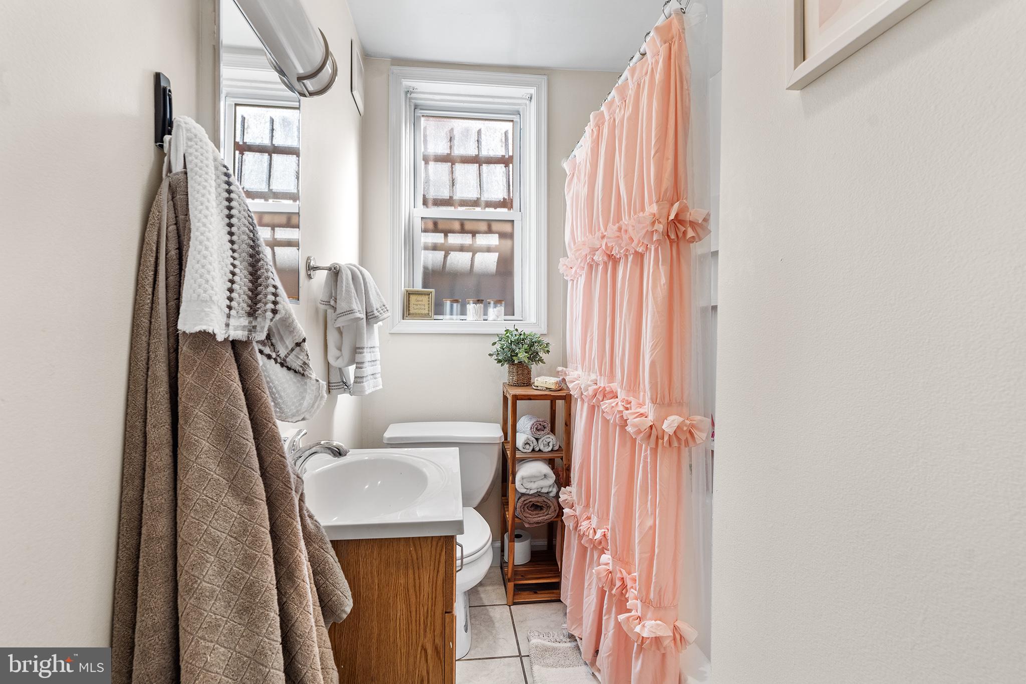 1712 Pine Street Philadelphia, PA 19103 - Photo 10 of 33 a living room with furniture and a window