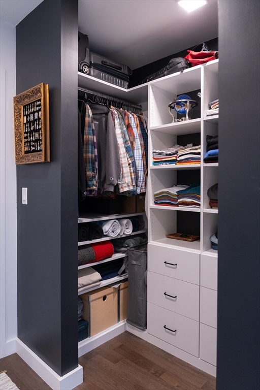 2 Sinclair Road, Unit 202 Boston, MA 02134 - Photo 12 of 23 a view of walk in closet with clothes and shoes