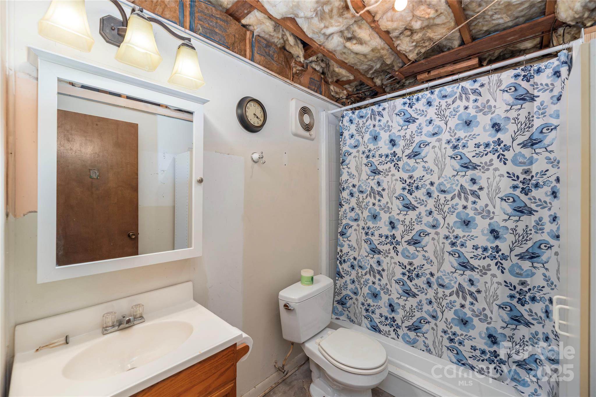 29 Arrowhead Street Clyde, NC 28721 - Photo 13 of 18 a bathroom with a toilet and a sink