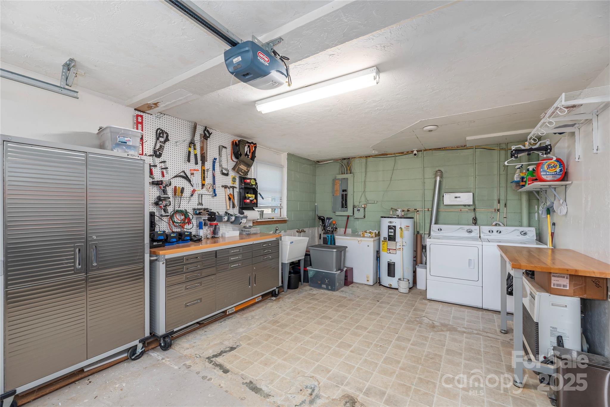 29 Arrowhead Street Clyde, NC 28721 - Photo 14 of 18 a view of a storage & utility room with lots of racks on the wall