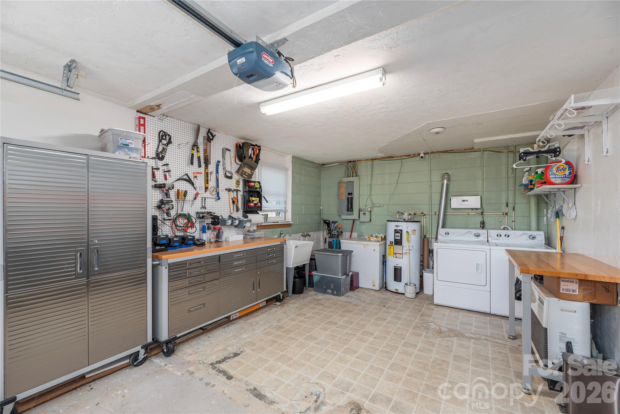 29 Arrowhead Street Clyde, NC 28721 - Photo 14 of 18 a view of a storage & utility room with lots of racks on the wall