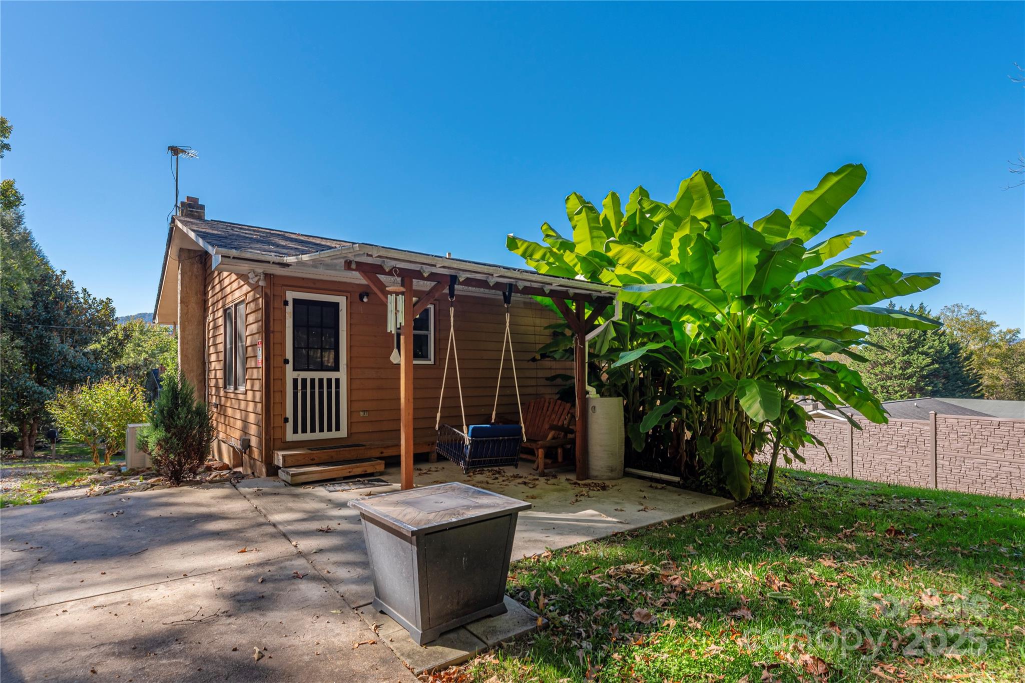 29 Arrowhead Street Clyde, NC 28721 - Photo 16 of 18 a backyard of a house with seating space
