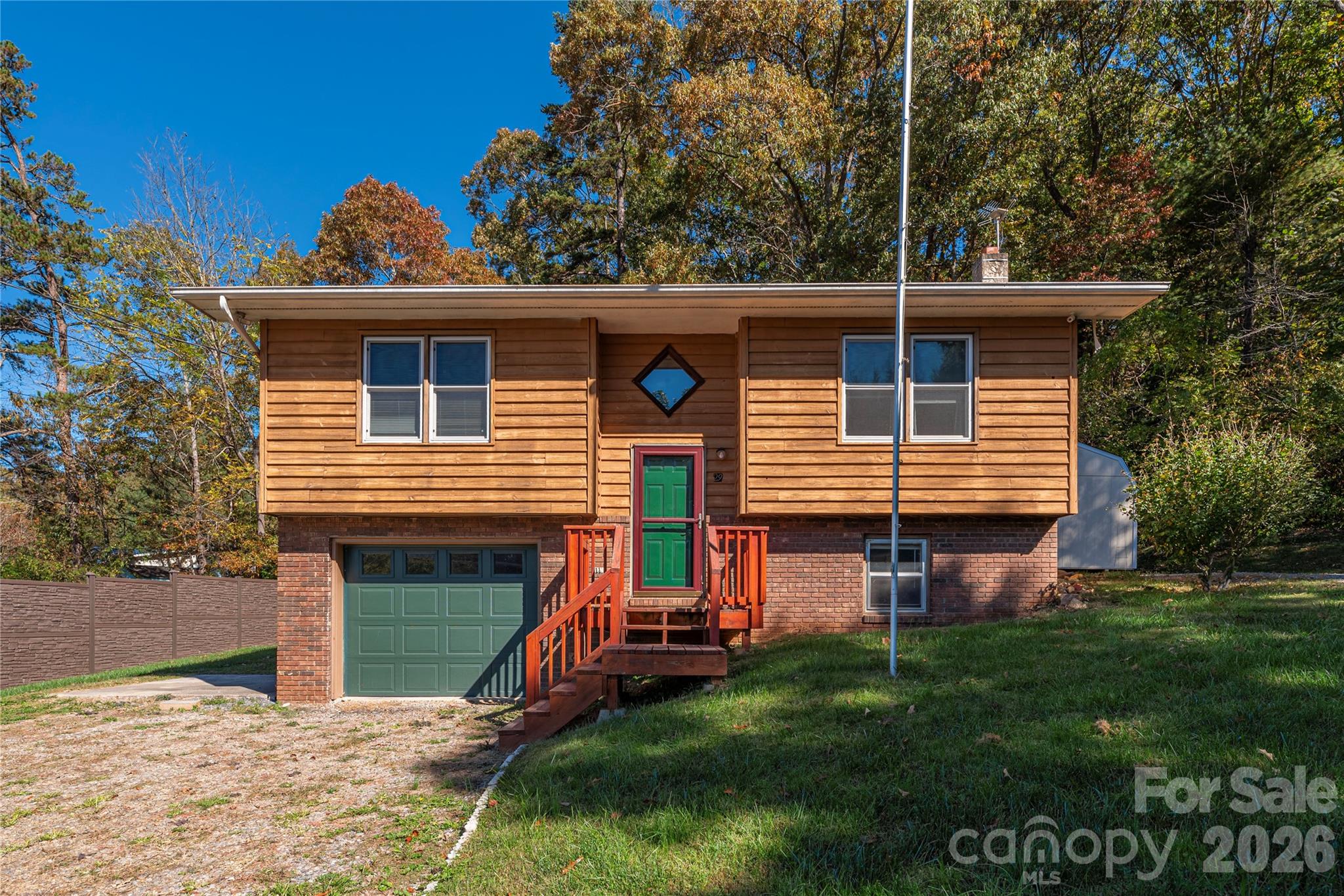 29 Arrowhead Street Clyde, NC 28721 - Photo 2 of 18 front view of a house with a yard