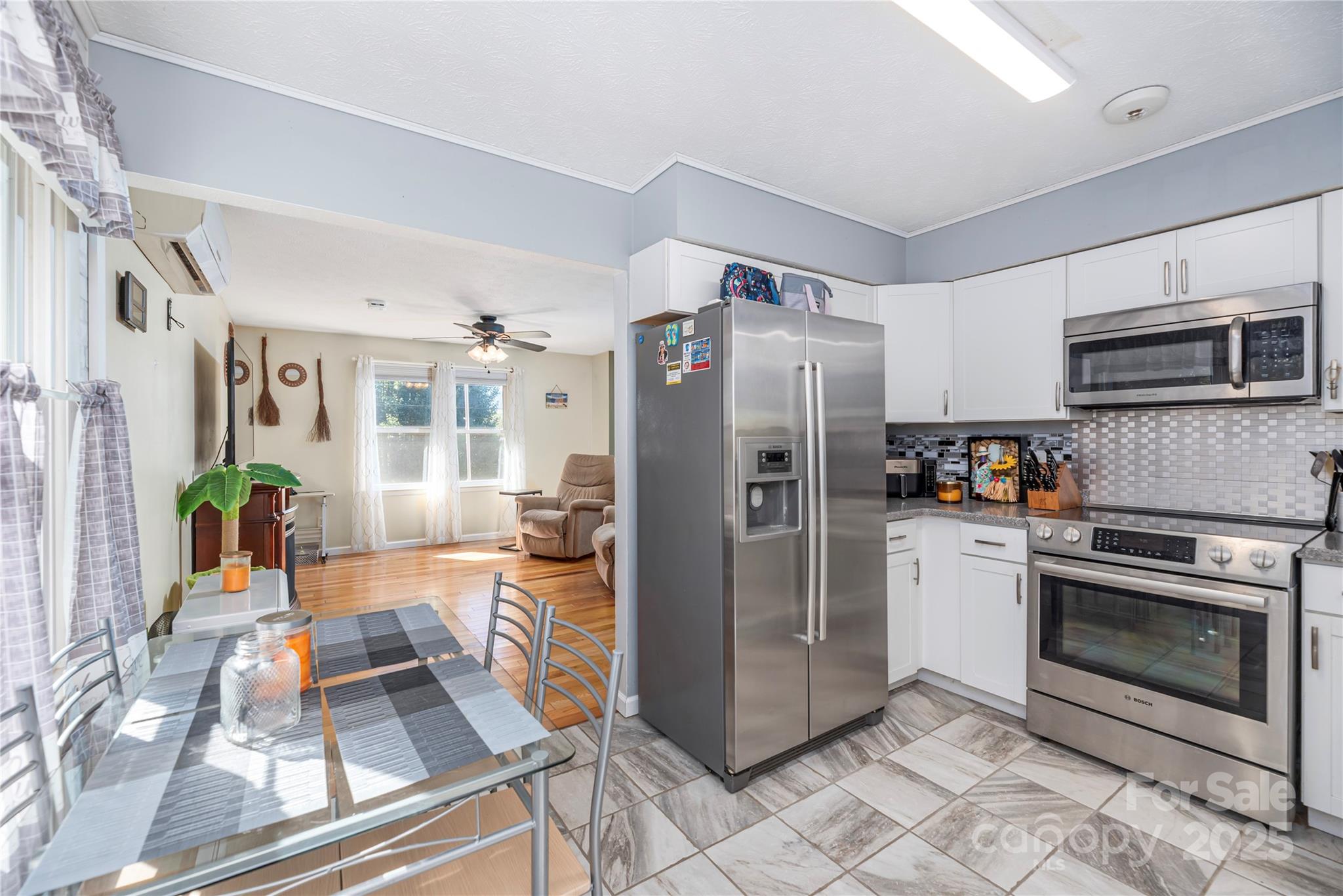 29 Arrowhead Street Clyde, NC 28721 - Photo 7 of 18 a kitchen with stainless steel appliances granite countertop a refrigerator stove and sink